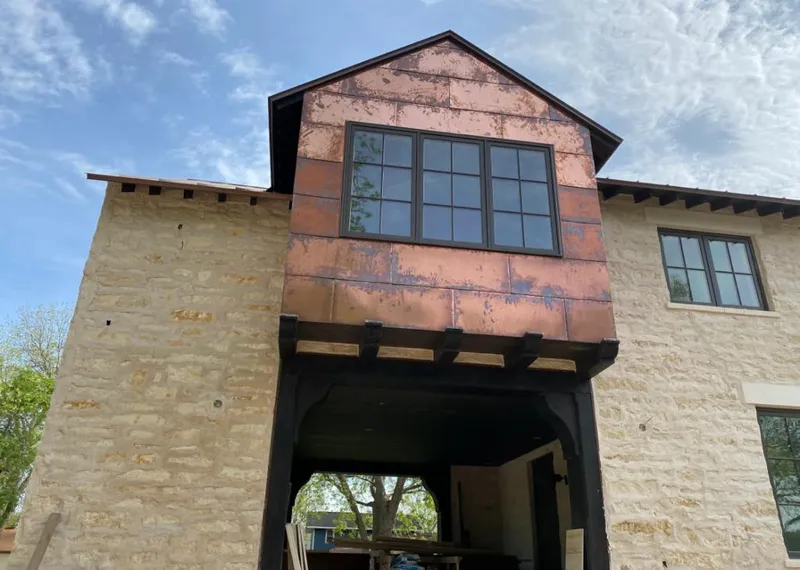 Copper metal panel facade on a stone building for Skylight Installation in Lahaina