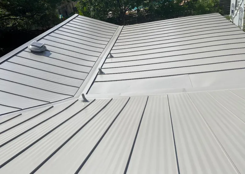 Solar attic fan installed on a metal roof for Roof Ventilation in Lahaina